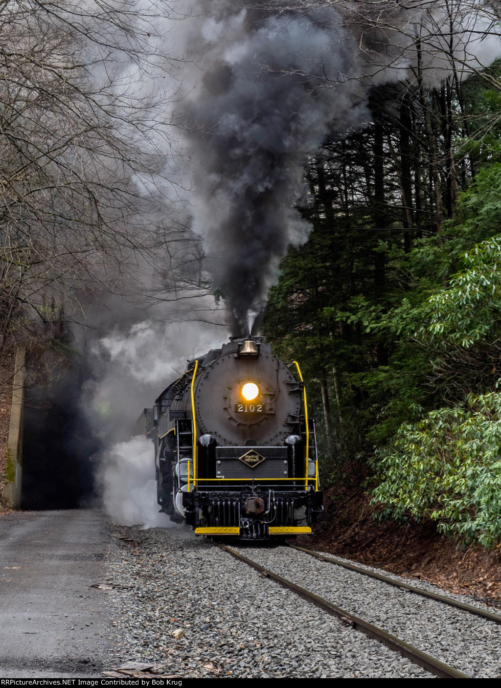 RBMN 2102 has it's booster engine engaged for extra traction while starting the 50 hopper car train on the Hometown Hill grade